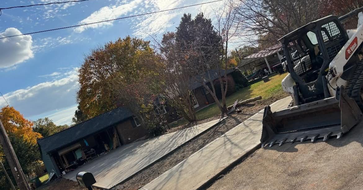 Professional Concrete Driveway Replacement installation in Huntersville, North Carolina by Local Concrete Co — commercial-grade base prep, 6-inch compacted aggregate, expansion joints sawn within 12 hours.