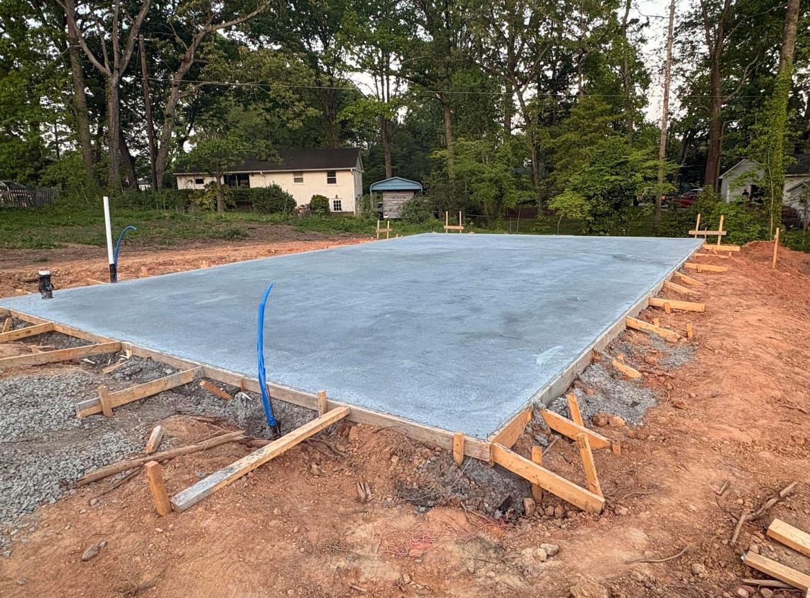 Local Concrete Co Concrete Foundations project in Huntersville, North Carolina (Mecklenburg County) — 4000 PSI commercial-grade concrete, expansion joints, professional broom or smooth finish.